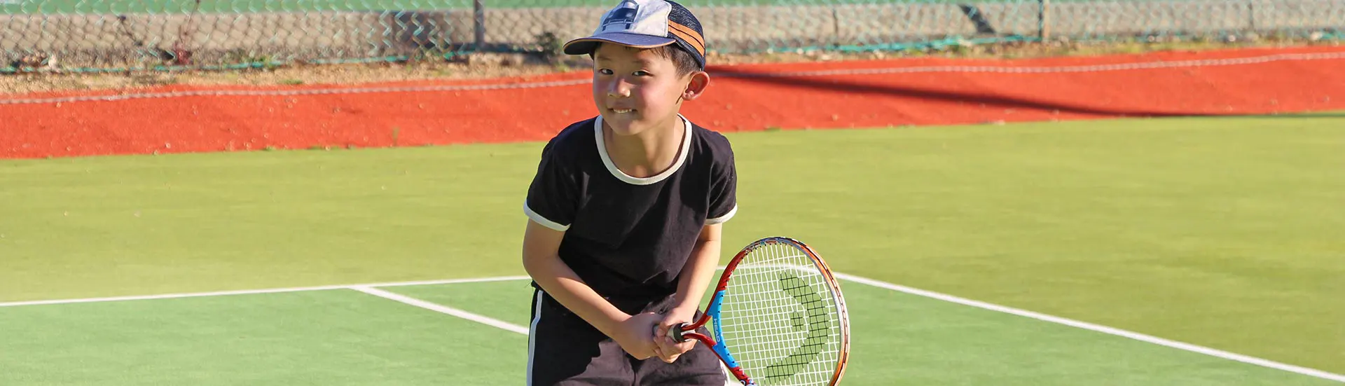 Young boy ready to play tennis